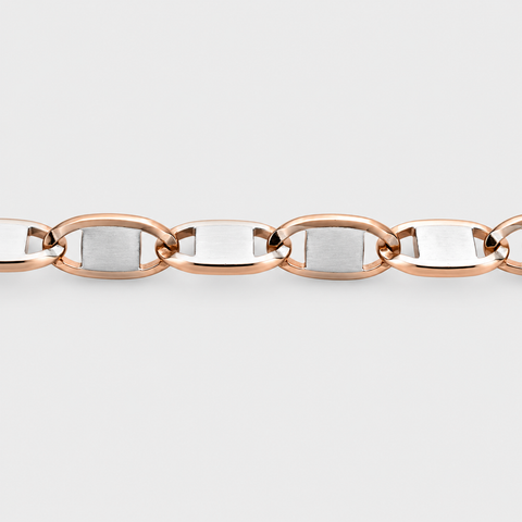 Detailed view of the polished rose gold links with satin-finished white gold center plates on the Valentino chain necklace.