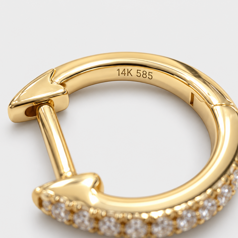 Hallmark detail of Diamond Drop Huggie Earrings in 14K Yellow Gold.