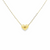 Close-up of 14K gold puff heart pendant necklace with polished surface.