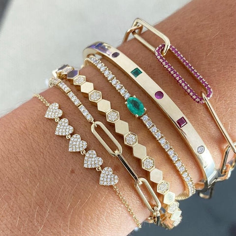 angled view of jewelry in 14k gold